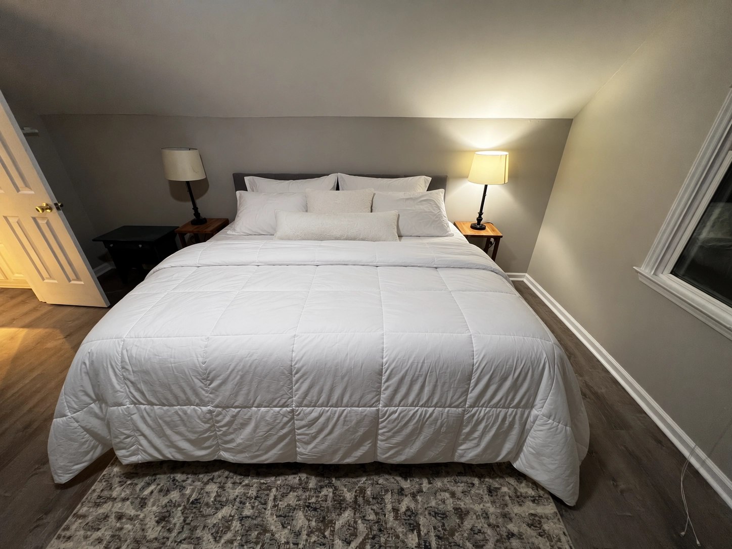 Same bedroom, made bed